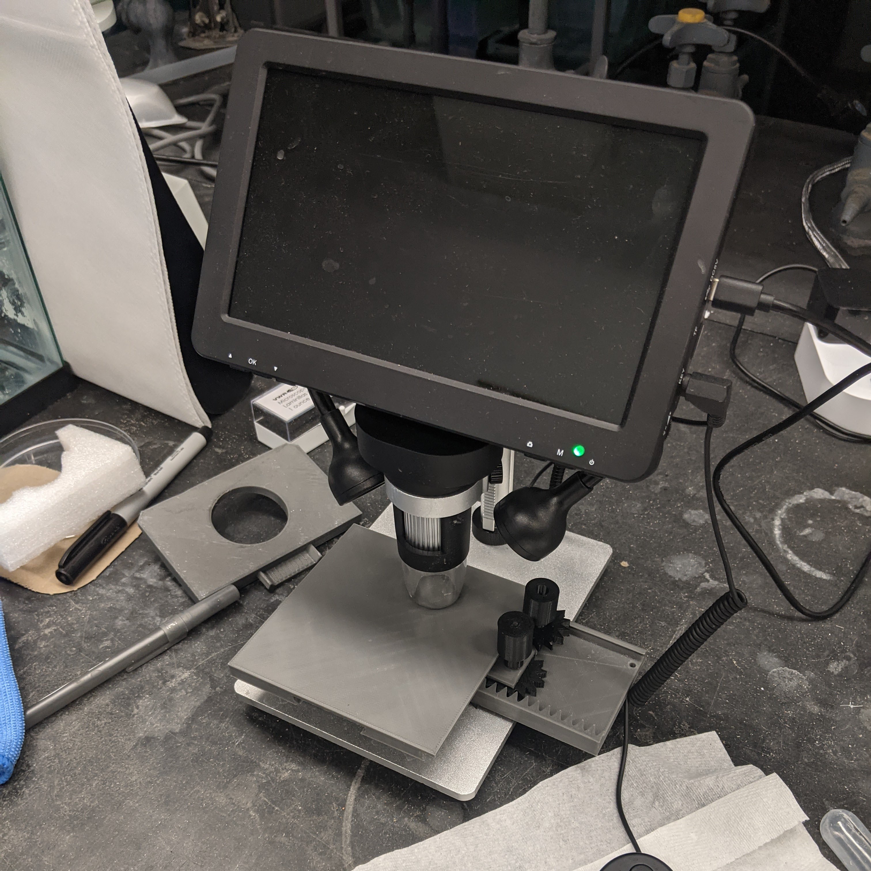 The gliding table can go with elementary level commerical grade scopes from Amazon