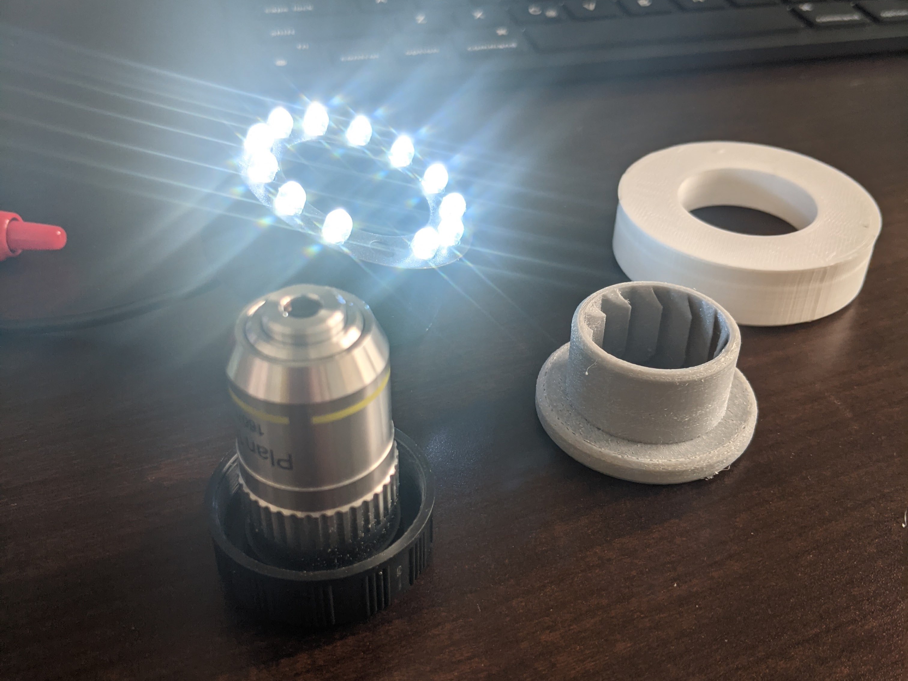 The adaptor to latch the commonly found commercial ring LED on the lens