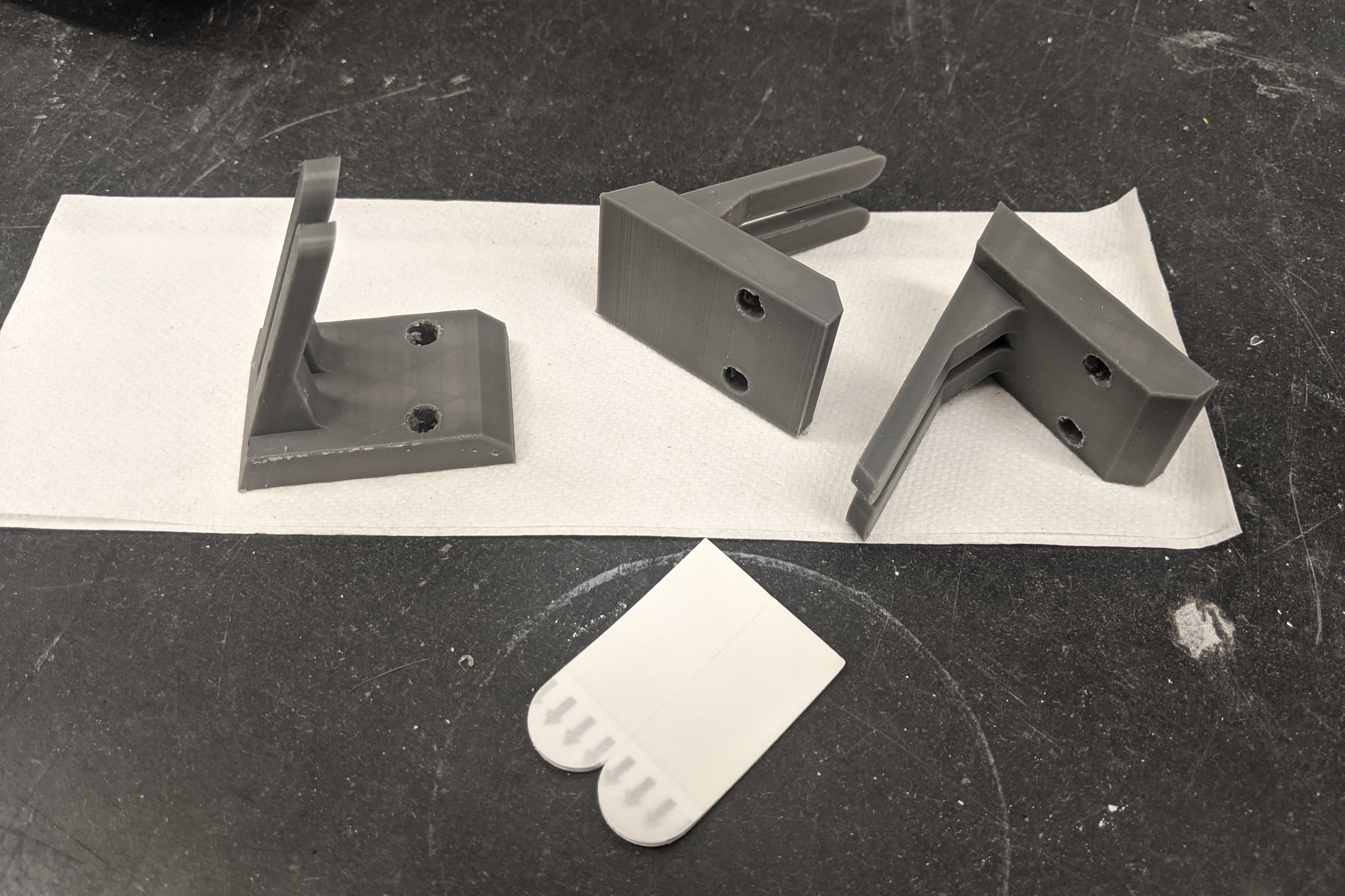  The hanger variant that can be taped or screwed on flat surface