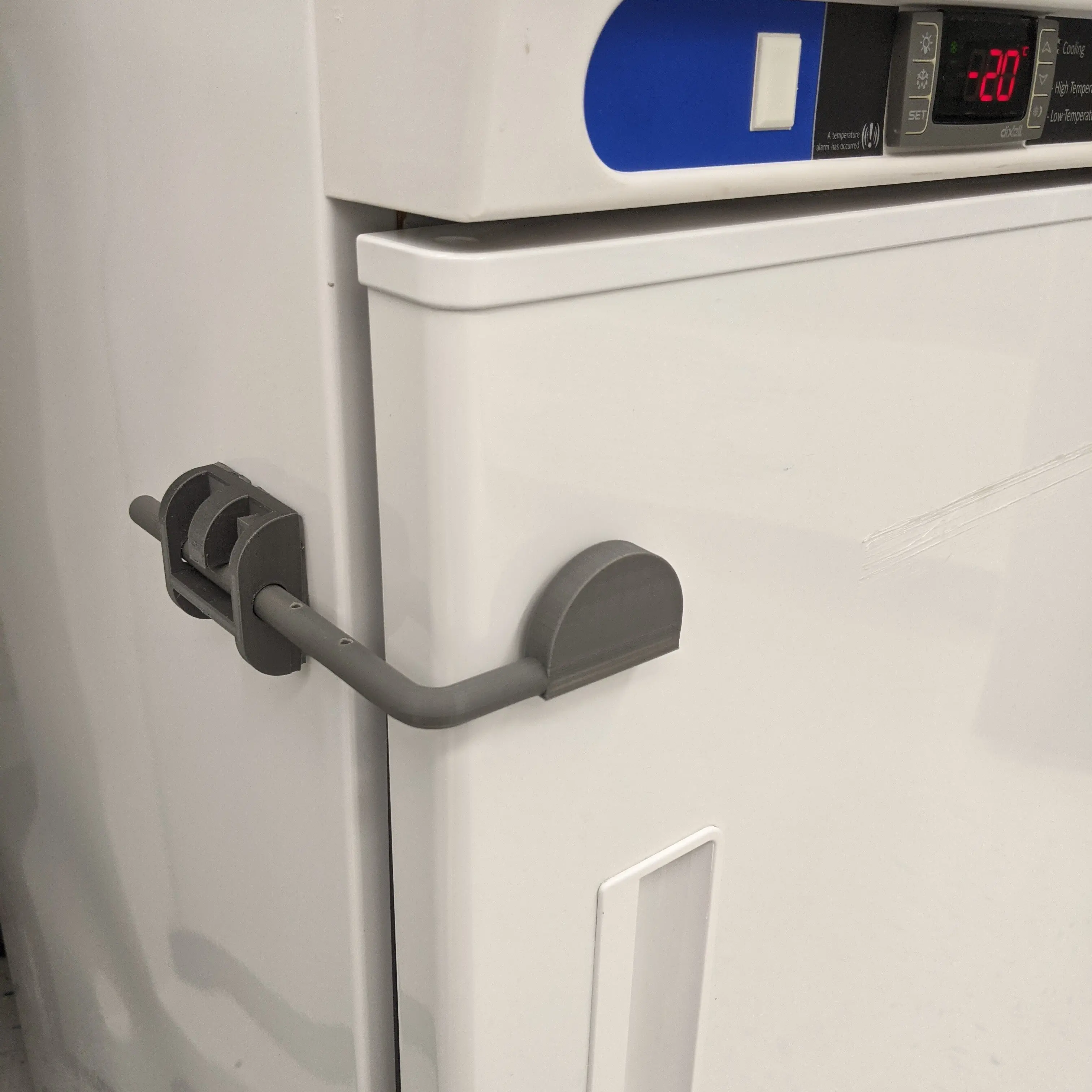 The shutter mounted on a fridge.